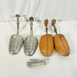 Sale Photo Thumbnail #194: Collection of vintage shoe stretchers, including two wooden pairs with turn-key adjustments, two metal pairs with perforated lasts, and a metal shoe horn.