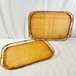 Sale Photo Thumbnail #118: Pair of vintage woven rattan and bamboo serving trays featuring rounded rectangular shapes and raised gallery rims.