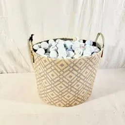 Sale Photo Thumbnail #4: Woven geometric-pattern storage basket filled with a large collection of used golf balls.