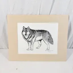 Sale Photo Thumbnail #207: Black-and-white ink illustration of a wolf, presented with a tan mat board.