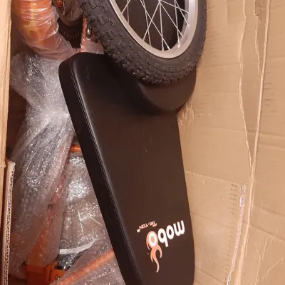 Mobo Triton recumbent tricycle components, new in box and disassembled with protective wrapping.