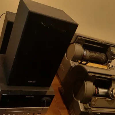 Collection of vintage electronics, including a Philips bookshelf stereo system, vintage dictation machines, and an Akai audio component.