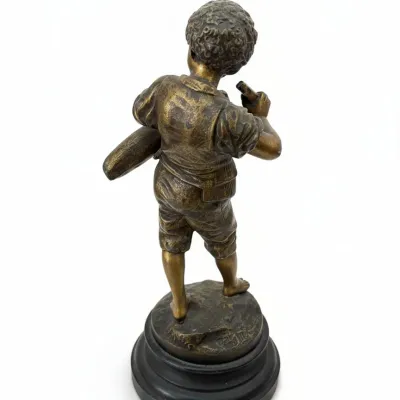 Sale Photo Thumbnail #60: Vintage bronze patinated figurine of a young boy