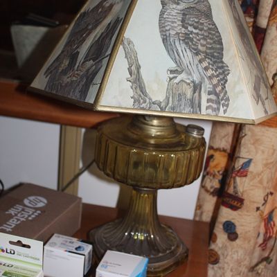 Sale Photo Thumbnail #83: Vintage amber glass oil-style electric table lamp featuring a hexagonal shade with printed owl illustrations.