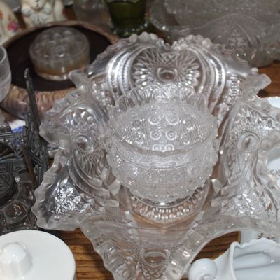 Sale Photo Thumbnail #6: Collection of vintage pressed clear glass items, including a ruffled rim bowl, small starburst pattern bowl, and a metal inkwell stand.