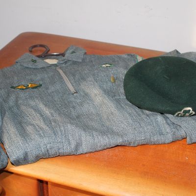 Sale Photo Thumbnail #96: Vintage Girl Scout uniform shirt with embroidered patches and a matching dark green felt beret.