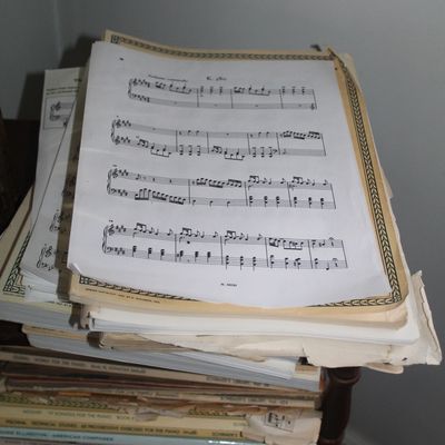 Sale Photo Thumbnail #32: Large stack of vintage and modern sheet music and piano books, including works by Scott Joplin and Mozart.
