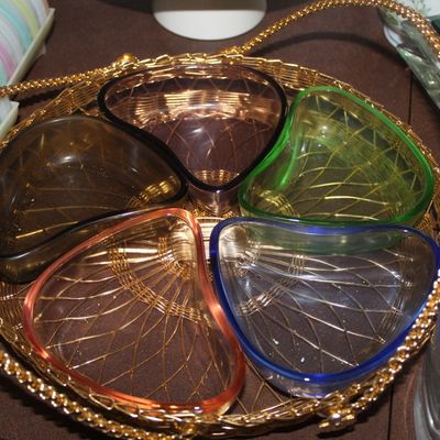 Sale Photo Thumbnail #41: Vintage mid-century divided relish tray with colorful glass insert bowls set inside a gold-tone woven wire basket.