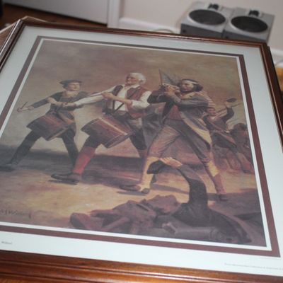 Sale Photo Thumbnail #79: Framed print of Archibald Willard's iconic Revolutionary War painting 'The Spirit of '76', presented in a stained wooden frame with matting.