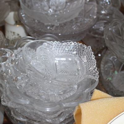 Sale Photo Thumbnail #20: Collection of vintage clear pressed glass dishes, including serving bowls, nappies, and trinket dishes with various embossed geometric and floral patterns.