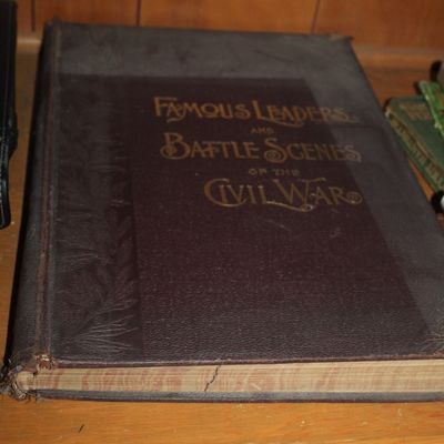 Sale Photo Thumbnail #68: Antique oversized book, "Famous Leaders and Battle Scenes of the Civil War," featuring an embossed hard cover with gilt lettering.