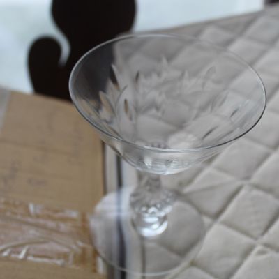 Sale Photo Thumbnail #18: Single cut crystal martini or cocktail glass featuring an etched leaf and floral design around the bowl and a faceted stem.