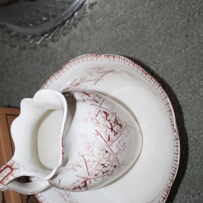 Sale Photo Thumbnail #19: Vintage red Transferware pitcher and bowl set featuring a delicate floral pattern and decorative border.