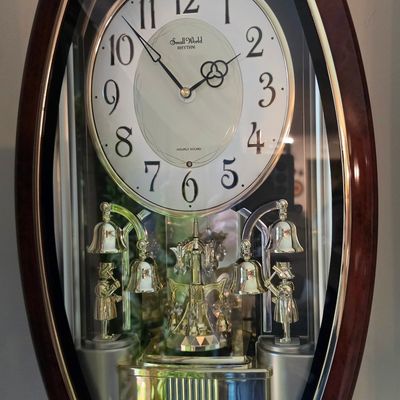 Sale Photo Thumbnail #167: Rhythm Small World 4MH740 'Golden Ringers' Magic Motion Musical Wall Clock