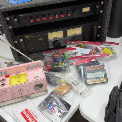 Radio Shack stereo power amplifier and microphone mixer in a carpeted road case, SentrySafe lockbox, vintage toy kitchen set, and various...