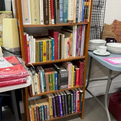 Books on various topics, including cookbooks, fiction, and reference titles, priced at $2 each.