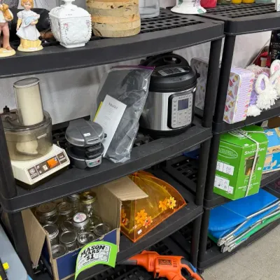 Assorted household goods, including kitchen appliances like an Instant Pot electric pressure cooker and vintage GE food processor, along...