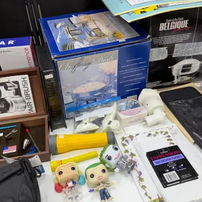 Household goods including boxed stainless steel chafing dishes, an air-brush kit in a wooden case, flashlights, Funko Pop figures, and...