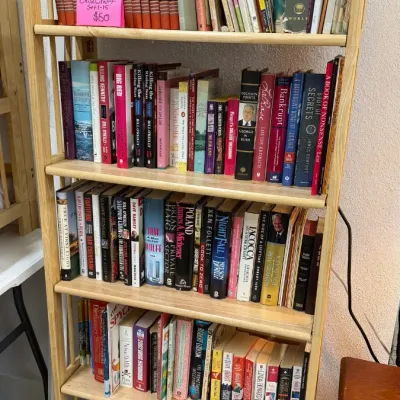 Selection of hardcover and paperback books, including a complete 15-volume Childcraft set, dictionaries, and various fiction and...