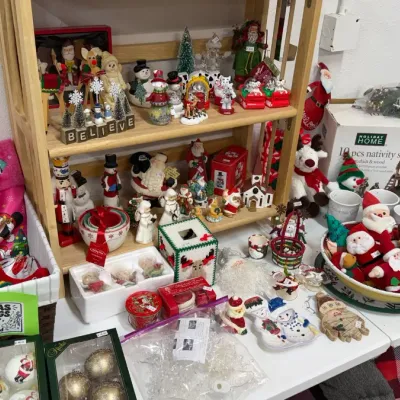 Christmas decorations, including stockings, Santa and snowman figurines, ornaments, nutcrackers, and a Holiday Home 10-piece porcelain...