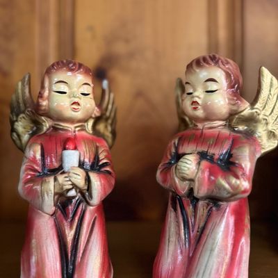Sale Photo Thumbnail #7: Pair of vintage mid-century choir boy angel figurines in red and gold painted ceramic, one holding a candle and one praying.