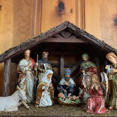 Sale Photo Thumbnail #6: Vintage painted ceramic Nativity set with a wooden creche, including figures of the Holy Family, Wise Men, an angel, and animals.