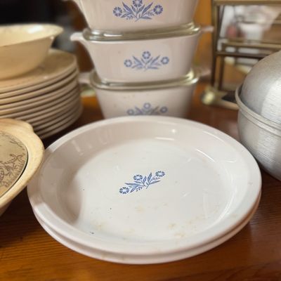 Sale Photo Thumbnail #50: Vintage CorningWare Blue Cornflower pie plates and stacked casserole dishes with glass lids.
