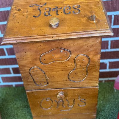 Sale Photo Thumbnail #38: Vintage rustic wooden potato and onion storage bin featuring carved labeling and decorative potato motifs.