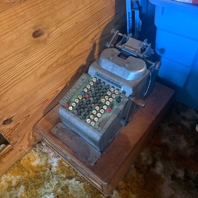 Sale Photo Thumbnail #4: Vintage mechanical adding machine with hand crank mounted on a wooden base