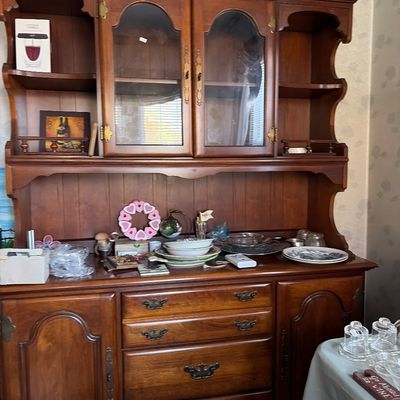 Sale Photo Thumbnail #8: Traditional wooden china cabinet and hutch with arched glass-front doors, open shelving, and lower drawers and cabinets.