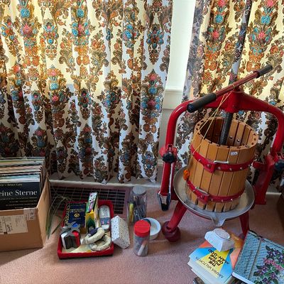 Sale Photo Thumbnail #2: Vintage manual fruit and wine press with a red metal frame and wooden slat basket