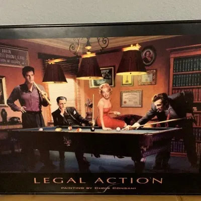 Framed "Legal Action" art print by Chris Consani, depicting famous pop culture icons playing pool in a thin black frame.