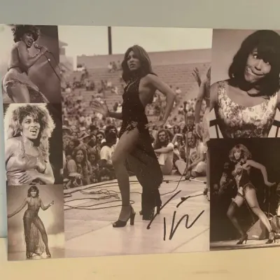 Autographed black and white photo collage poster featuring iconic performance images of Tina Turner.