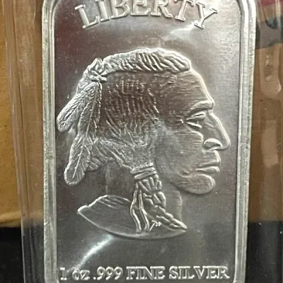 One-ounce .999 fine silver bullion bar featuring a Native American chief profile design, encased in a protective clear plastic capsule.