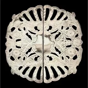 Vintage ornate silver-plated or sterling silver cloak clasp with intricate openwork floral motifs.