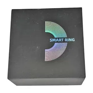Black packaging box for a Smart Ring featuring holographic rainbow branding on the lid.