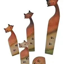Set of five stylized folk art cat figurines featuring hand-painted paw print details and warm gradient tones.
