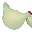 Set of three vintage stylized ceramic chicken figurines with light green bodies and red details.
