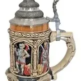 German-style lidded ceramic beer stein with relief-carved figures of knights in armor and an ornate pewter crown lid.