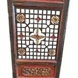 Antique Chinese carved wooden screen panel featuring intricate lattice design, gilt accents, and decorative carved relief panels.