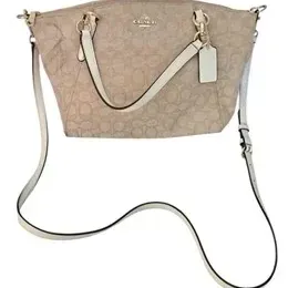 Coach beige signature Jacquard canvas satchel handbag with cream leather trim, double handles, detachable shoulder strap, and leather...