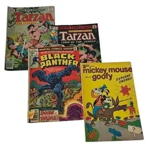 Collection of four vintage comic books featuring Tarzan, Black Panther #7, and Mickey Mouse and Goofy Explore Energy, showing minor wear...