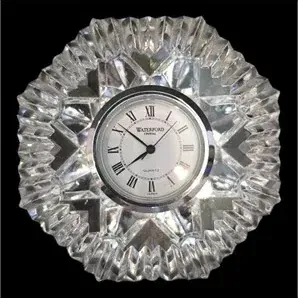 Waterford Crystal quartz desk clock with a heavy cut glass frame and white dial featuring Roman numerals.