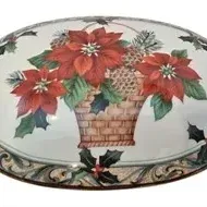 Oval ceramic holiday dish lid featuring a printed poinsettia arrangement in a woven basket with holly sprig accents.