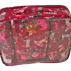 Vera Bradley multi-piece travel cosmetic set in a red festive dog pattern, featuring a clear outer zip case and smaller quilted pouch...