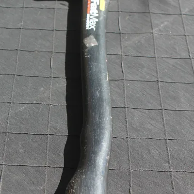 Sale Photo Thumbnail #49: Stanley FatMax framing hammer with a black handle, showing light rust and surface wear on the metal head.