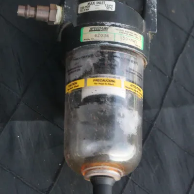 Sale Photo Thumbnail #28: Speedaire pneumatic air filter regulator unit with a clear bowl, showing light wear and scuffing from previous use.