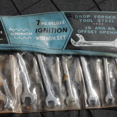 Sale Photo Thumbnail #61: Vintage Globemaster 7-piece deluxe ignition wrench set in original clear vinyl pouch.