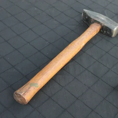 Sale Photo Thumbnail #25: Vintage heavy-duty cross-peen hammer featuring a forged steel head mounted on a smooth wooden handle.