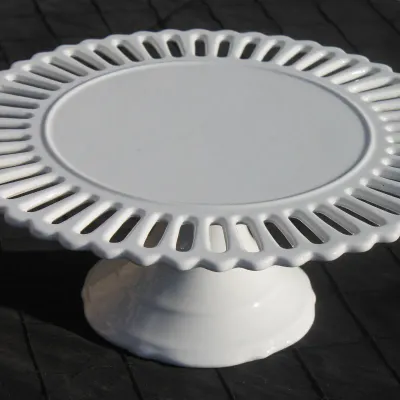 Sale Photo Thumbnail #11: Vintage white milk glass pedestal cake stand featuring a openwork lattice or slotted border.